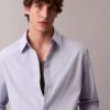 Einfarbiges, locker sitzendes Button-Down-Hemd aus Baumwolle Einfarbiges, locker sitzendes Button-Down-Hemd aus Baumwolle
