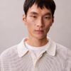 Glatter Polo-Pullover aus Baumwolle mit Waffelmuster Glatter Polo-Pullover aus Baumwolle mit Waffelmuster