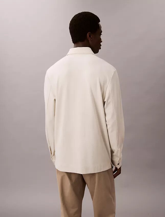 Jacquard-Polo-Pullover in lockerer Passform Jacquard-Polo-Pullover in lockerer Passform