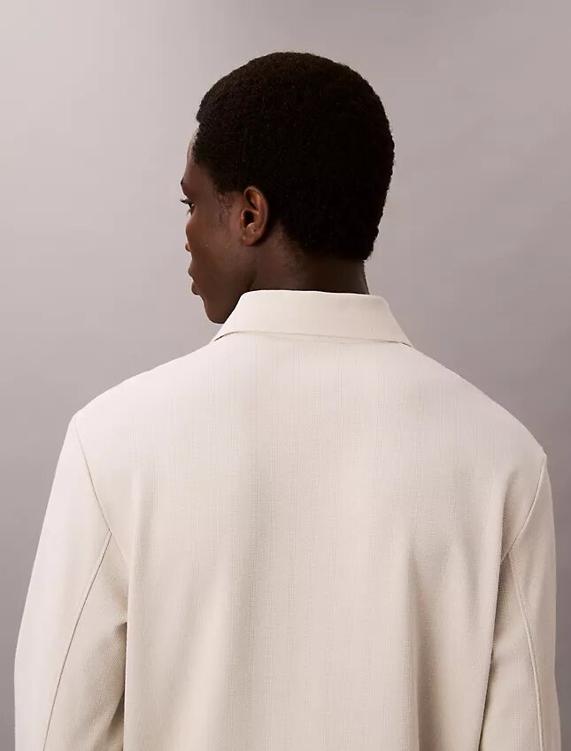 Jacquard-Polo-Pullover in lockerer Passform Jacquard-Polo-Pullover in lockerer Passform