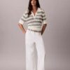 Polo-Shirt aus offenem Strick Polo-Shirt aus offenem Strick