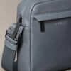 Reporter-Tasche mit genarter Oberfläche Reporter-Tasche mit genarter Oberfläche